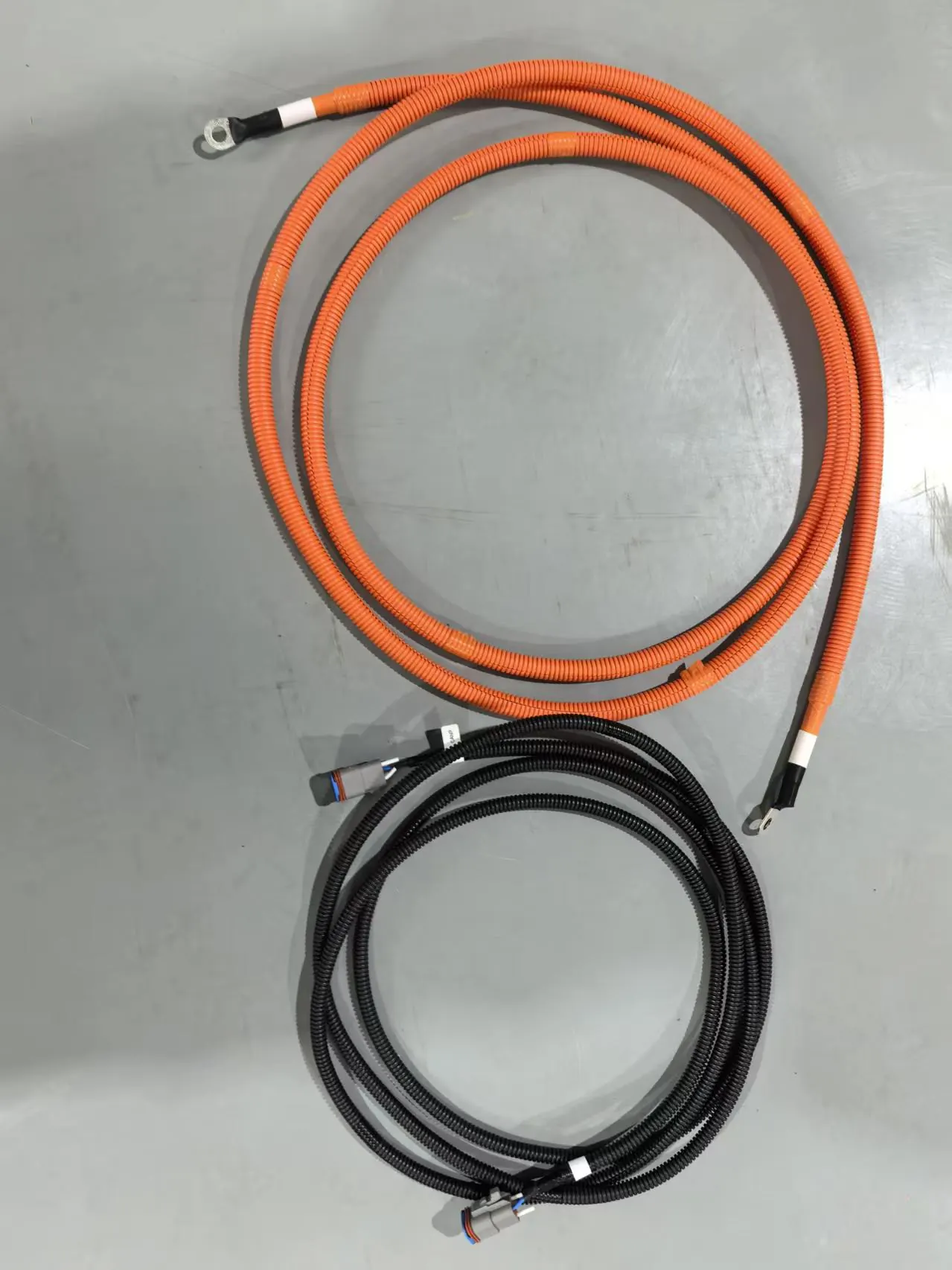 Rail and transit UPS battery-backup wire harness assembly